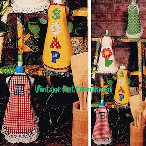 May include: A collection of decorative soap dispenser covers in the shape of aprons. One is red and white checkered, and others are yellow, white, and green with the word "SOAP" appliqued on them. The text "Vintage Pattern Haven" is also visible.