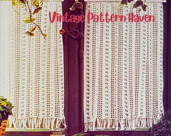 May include: Cream-colored, crocheted window curtains with a fringe at the bottom. The curtains are hanging in front of a dark brown door. The text "Vintage Pattern Haven" is written in red across the image.