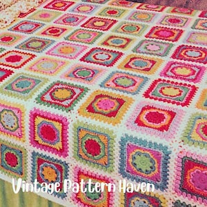 May include: A colorful, handmade crochet blanket featuring a patchwork design of squares in various colors including pink, yellow, green, and blue. The blanket has a white background and the text "Vintage Pattern Haven" is visible.