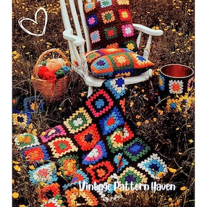 May include: A white rocking chair with two crocheted cushions and a blanket in a field of yellow flowers. The cushions and blanket feature a colourful granny square design. A basket of yarn and a decorative container are also present. The text "Vintage Pattern Haven" is visible.