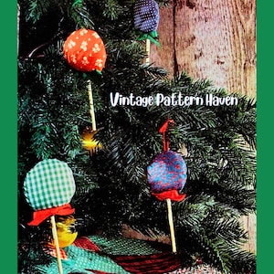 May include: Christmas tree decorated with handmade fabric ornaments in various patterns and colors, including red with white flowers, blue with red dots, and green gingham. The text "Vintage Pattern Haven" is visible.