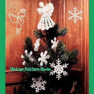 May include: A Christmas tree decorated with white crocheted angel ornaments and snowflakes. The tree is set against a wooden background. The words "Vintage Pattern Haven" are visible on the image.