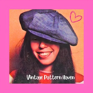 May include: A woman wearing a dark blue denim newsboy cap. The image has a pink border and a heart doodle in the upper right corner. The text "Vintage Pattern Haven" is at the bottom of the image.