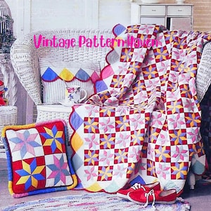 May include: A white wicker chair draped with a colorful quilt and pillows. The quilt and pillows feature a star pattern in red, pink, yellow, and blue. The text "Vintage Pattern Haven" is visible on the image. Red shoes are at the base of the chair.
