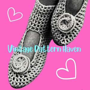 May include: A pair of crocheted slippers with a button detail. The slippers are white and have a lacy design. The image is on a pink background with hearts.