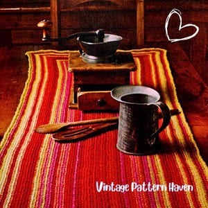 May include: A vintage-style kitchen scene featuring a red, yellow, and pink striped runner. A black mortar and pestle sits atop a wooden grinder. A metal pitcher and wooden utensils are on the runner. The text "Vintage Pattern Haven" is visible.