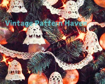 May include: A close-up of a Christmas tree decorated with white crocheted bells and a white crocheted garland. The tree is also decorated with shiny gold ornaments and white lights. The text "Vintage Pattern Haven" is visible in the image.