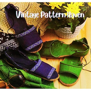 May include: Sandals in blue and green with rope soles and patterned straps. The image includes a straw hat, sunglasses, and a green towel. The text "Vintage Pattern Haven" is visible. The sandals are displayed on a wooden surface.