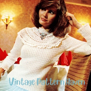 May include: A cream-colored, long-sleeved crochet top with a scalloped collar. The top has a textured pattern and is paired with a light blue skirt. The text "Vintage Pattern Haven" is visible at the bottom of the image.