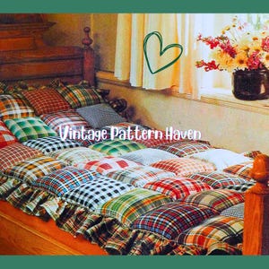 May include: A bed featuring a patchwork quilt made from a variety of plaid fabrics in shades of red, green, and yellow. The bed has a wooden headboard and footboard. The text "Vintage Pattern Haven" is visible.