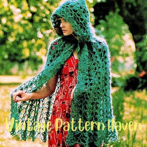May include: A vintage crochet pattern for a hooded shawl. The shawl is made of green yarn and has a lacy design. The pattern is for a hooded shawl with a lacy design.