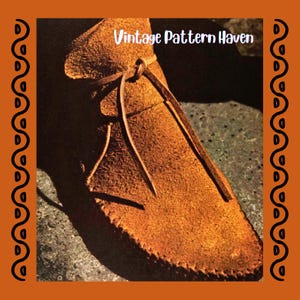 May include: Close-up of a brown suede moccasin with a tied leather lace. The shoe has visible stitching along the edges and is set against a textured background. The text "Vintage Pattern Haven" is visible in the image.