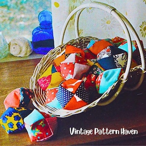 May include: A woven wicker basket filled with small, multi-colored fabric cubes featuring various patterns like polka dots, florals, and geometric shapes. The text "Vintage Pattern Haven" is printed in white at the bottom right of the image.