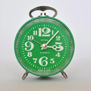 Vintage green Russian mechanical alarm clock from Vityaz, USSR
