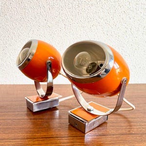 Pair of Orange Eyeball Space Age lamps from the 70s | Vintage adjustable Eyeball wall Lamps