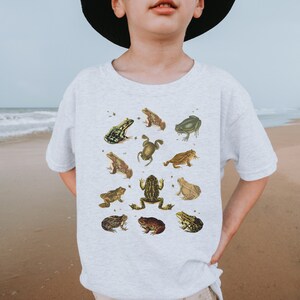 Vintage Frog and Toad graphic Shirt: twelve vintage illustration of frogs and toads decorated with flys printed on a gildan 5000b youth shirt. Here wear by a little boy