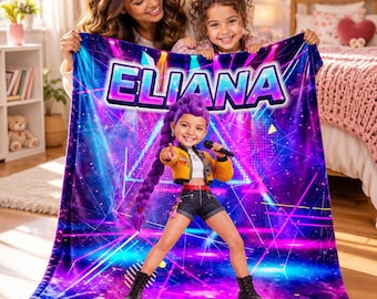 May include: A soft plush blanket featuring the name ELIANA in bold blue and purple letters. The design displays a cartoon character with a long purple braid, wearing a yellow jacket and black shorts, holding a microphone against a neon background.