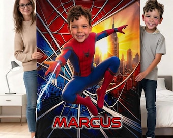 May include: A rectangular fleece blanket featuring a graphic of a child dressed as Spider-Man in a dynamic pose against a city skyline background with a spiderweb pattern. The name MARCUS is printed in bold red letters at the bottom.