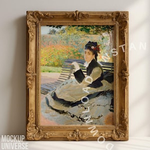 May include: A framed oil painting of a woman seated on a park bench, wearing a black jacket and a hat with flowers. The painting has a gold ornate frame and is displayed against a white wall.