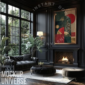 May include: A black leather sofa with tufted upholstery sits in a dark room with a fireplace and a large window. A framed abstract painting with geometric shapes in red, green, and gold hangs above the fireplace.