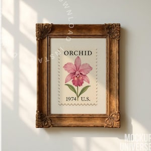 May include: A framed print featuring a vintage orchid stamp design. The stamp, labeled "ORCHID" and "1974 U.S.", showcases a pink orchid with green leaves. The frame is ornate, with a dark brown finish.