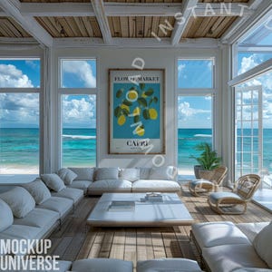 May include: A bright, airy living room with a view of the ocean. The room features white sofas, a wooden floor, and large windows. A framed poster with lemons and the word "Capri" hangs on the wall. Wicker chairs and a coffee table complete the scene.