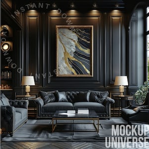 May include: A black leather sofa with tufted upholstery sits in a dark room with black walls and wood paneling. A framed abstract painting with gold and white accents hangs above the sofa. Two lamps with white shades stand on end tables on either side of the sofa. A black coffee table with a marble top sits in front of the sofa.