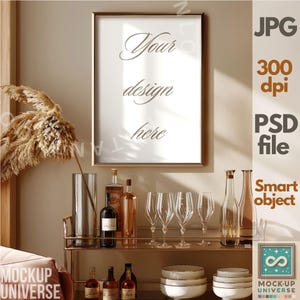 May include: A gold framed poster mockup with the text "Your design here" on a white background. The poster is on a shelf with a bar cart, wine bottles, and glasses. The bar cart is on a light brown surface.