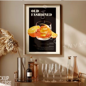 May include: A framed poster with the text "Old Fashioned" and an illustration of an orange cocktail in a glass. The poster is hanging on a wall above a bar cart with bottles and glasses.