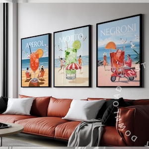 May include: Three framed illustrations of cocktails with beach scenes. The illustrations are titled "Aperol", "Mojito", and "Negroni".