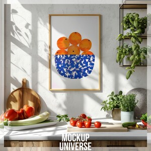 May include: A framed print of a bowl of oranges on a white background. The bowl is blue and white with a brushstroke pattern. The oranges are a vibrant orange colour.