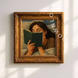 May include: A framed painting featuring a woman reading a book. The woman is in bed, holding a green book up to her face. The painting has a gold ornate frame and is hanging on a white wall.