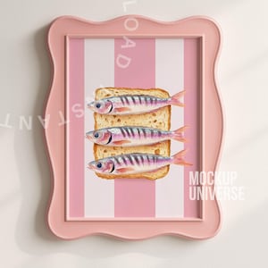 May include: A pink framed print featuring three sardines on toast against a pink and white striped background. The artwork has a whimsical, illustrative style, with the text "MOCKUP UNIVERSE" visible.