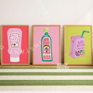 May include: Three framed art prints with humorous designs. One features a pink sauce bottle labeled "SELF LOVE SAUCE", another a green bottle of "HOT STUFF", and the last a pink juice box with "BAD BITCH Juice". The frames are a light brown color.