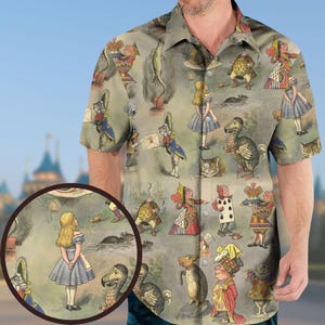 May include: Short-sleeved button-down shirt featuring a repeating pattern of illustrations from Alice in Wonderland. The design includes characters like Alice, the Mad Hatter, and the Cheshire Cat, in a whimsical, storybook style.