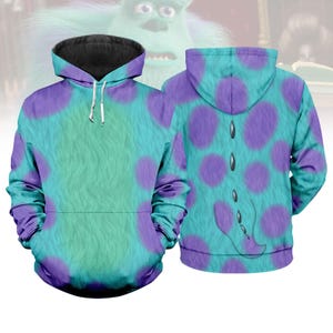 May include: A teal and purple hoodie with a design inspired by a fictional character. The front of the hoodie has a teal base with purple polka dots, while the back has a tail-like design. The hoodie has a black hood and a kangaroo pocket.