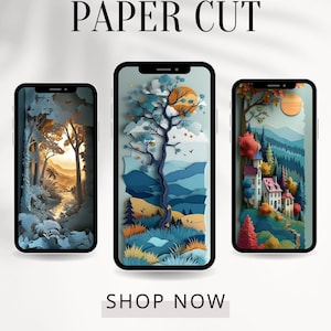 May include: Three phone mockups showcasing paper cut art designs. The first design features a forest scene with a path leading to a sunset. The second design features a tree with a sun and clouds in the background. The third design features a village with a castle and mountains in the background. The text "PAPER CUT" is at the top of the image and "SHOP NOW" is below the mockups. The text "ArtisticPixelsAU" is at the bottom of the image.