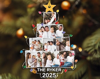 May include: A Christmas tree-shaped ornament with family photos, a gold star, and colorful lights. The ornament has the text "THE RYKER 2025" at the bottom. It is hanging from a gold string against a blurred Christmas tree background.