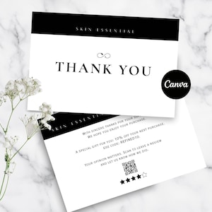 Puede incluir: Dos tarjetas blancas con texto y acentos negros. La tarjeta superior dice "THANK YOU" en letra grande, con "SKIN ESSENTIAL" arriba. Un círculo negro con "Canva" está a la derecha. La tarjeta inferior tiene texto adicional.