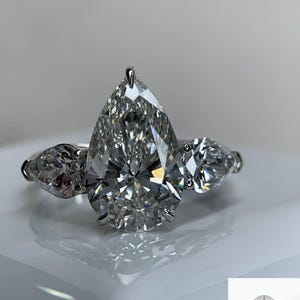 VS1 Clarity Three Stone Pear Cut Lab Diamond Engagement Ring | 14K White Gold Ring with 2 Carat Center Moissanite