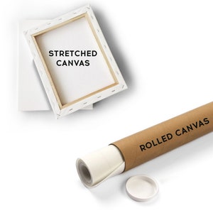a roll of rolled canvas next to a picture frame