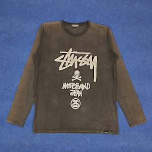 May include: Black long-sleeved shirt with a white Stussy logo, a skull and crossbones, and the text "Mastermind Japan" printed on the front.