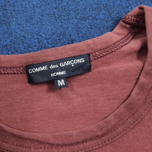 May include: A set of three ceramic mugs with a speckled, matte finish. The mugs are in shades of cream, light gray, and dark gray. Each mug has a simple, minimalist design, perfect for coffee or tea.