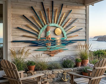 May include: A large metal wall art piece featuring a lighthouse and a sun, with radiating beams in shades of blue, copper, and teal. The design depicts a lighthouse on a shoreline with a circular sun, creating a coastal scene with wavy lines.