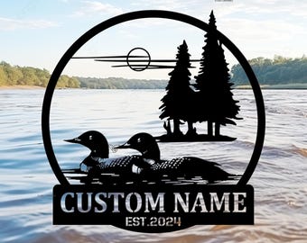 May include: Black metal sign with a silhouette of two loons swimming in a lake with trees in the background. The sign says "CUSTOM NAME EST. 2024".