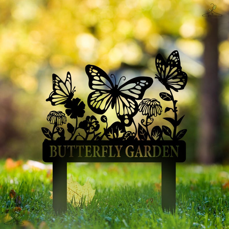 May include: Black metal garden stake with a butterfly garden sign. The sign features a silhouette of butterflies and flowers.