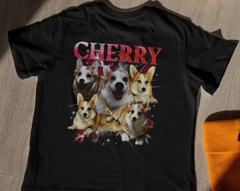 May include: Black t-shirt featuring a graphic of five corgis in a playful pose. The text "CHERRY" is printed in pink above the corgis.