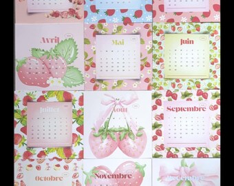 May include: A collection of twelve square calendars, each featuring a month's name and calendar grid. The calendars are decorated with strawberry motifs and pastel colors, including pink, blue, and green. The overall theme is a whimsical, fruity design.