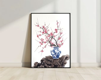 Peut inclure: Une peinture à l'aquarelle représentant une branche fleurie rose délicate dans un vase en porcelaine bleu et blanc. Le vase repose sur un morceau de bois usé, créant une scène sereine et élégante.
