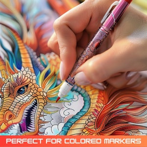 May include: A hand holding a pink and silver marker pen, coloring in a detailed drawing of a dragon with blue, green, gold, and red scales.  The dragon is on a white background.